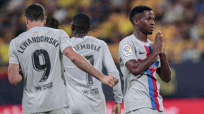Ansu Fati celebrates after scoring Barcelona's third goal against Cadiz. EPA