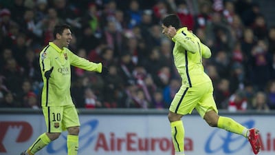 Luis Suarez of Barcelona, right, celebrates his goal with Lionel Messi during their side's 5-2 win over Athletic Bilbao in La Liga on Sunday. Juan Manuel Serrano Arce / Getty Images / February 8, 2015