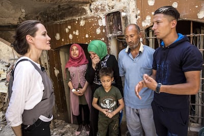 Angelina Jolie meets Mohamed and his family on her trip to Mosul as a UNHCR envoy. During the offensive to retake the city from ISIS, Mohamed's house was hit by an air strike, killing his 17 year-old daughter. Andrew McConnell / EPA