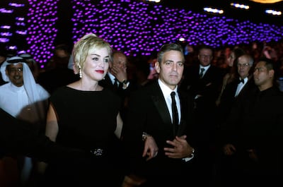 US actress Sharon Stone arrives with actor and director George Clooney at the Dubai International Film Festival in 2007. AFP