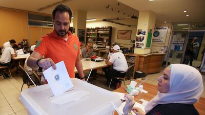 A man casts his vote at a polling station during the parliamentary election, in Sidon, Lebanon. Ali Hashisho / Reuters