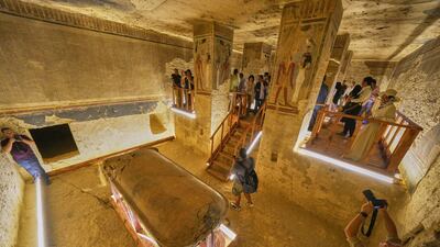 Visitors look at the tomb of Amenhotep III in the Valley of Kings in the southern city of Luxor, Egypt. AP