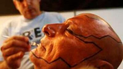 A make-up artist prepares Rifaat Tarabay before his performance in the play 'The Return of the Phoenix' at Airport Expo in Dubai.