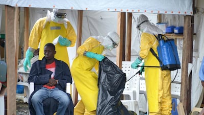 Health workers work inside a high-risk area on September 7, 2014 at Elwa hospital in Ebola-hit Monrovia. WHO chief Dr Tedros Adhanom told the World Government Summit in Dubai that nations must push for universal health coverage to help contain and limit the damage of potential outbreaks. Dominique Faget / AFP
