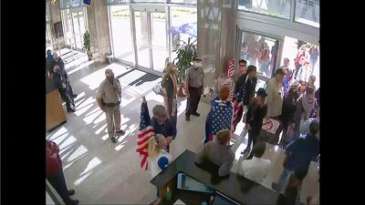 Security video from Arizona shows protesters gathering to contest the state's 2020 presidential vote certification. House select committee / AP