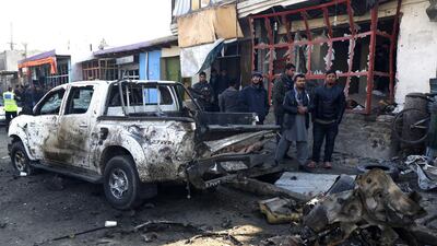 Local residents inspect the scene of a suicide bomb attack near Kabul International Airport in Kabul on December 28. At least one civilian was killed and thirteen were injured in the incident. EPA