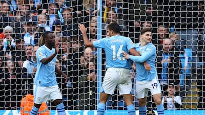 Manchester City's Julian Alvarez celebrates scoring their fifth goal with Jeremy Doku and Rodri. Reuters