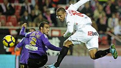 Sevilla's Luis Fabiano, right, scored two as his side drew against Malaga at the Sanchez Pizjuan.