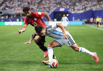 Marawan Attia challenges Argentina's Lisandro Martinez in the build-up to Egypt's disallowed second goal. AFP