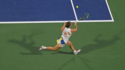 Romania's Simona Halep returns the ball to Kazakhstan's Elena Rybakina during the final of the Dubai Duty Free Tennis Championships in the United Arab Emirates on February 22, 2020. / AFP / KARIM SAHIB
