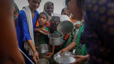 Food being distributed to displaced residents affected by the rising waters of the Yamuna river. Reuters