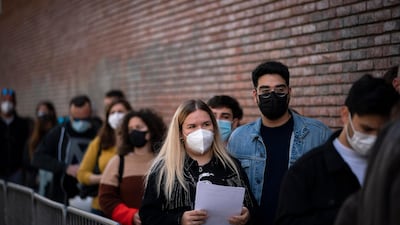 People line up outside a club to be screened for Covid-19 ahead of a music concert in Barcelona, Spain, on March 27, 2021. AP Photo