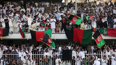 SHARJAH , UNITED ARAB EMIRATES : Oct 4 , 2013 :- Afghanistan fans celebrating after Afghanistan beat Kenya in the ICC World Cricket League Championship match between Afghanistan vs Kenya at Sharjah Cricket Stadium in Sharjah. Afghanistan won the match by 7 wickets. ( Pawan Singh / The National ) . For Sports. Story by Paul *** Local Caption *** PS0410- CRICKET40.jpg
