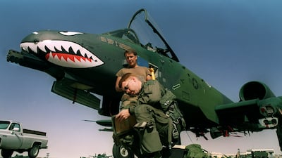 A US airman logs his flight at King Khaled military airport, near Dhahran, in November 1990. AFP