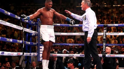 Referee Mike Griffin ends the fight between Anthony Joshua and Andy Ruiz Jr. PA