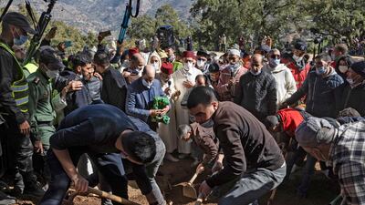 Moroccans burry the five-year-old after the funeral prayer. AFP