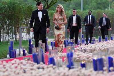 US Secretary of State Marco Rubio, left, walks with his wife Jeanette upon their arrival before a reception at the Roosevelt House in New Delhi on May 23. AFP