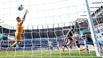Newcastle goalkeeper Martin Dubravka cannot stop City's Raheem Sterling scoring the first goal. AP