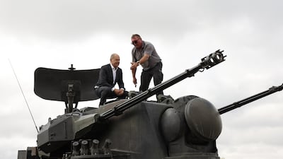 Mr Scholz being shown a Gepard anti-aircraft gun tank during his visit to the arms-maker Krauss-Maffei Wegmann. Germany promised Ukraine 30 Gepard self-propelled anti-aircraft tanks. Getty Images