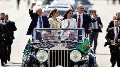 Brazil's president-elect Luiz Inacio Lula da Silva, vice president-elect Geraldo Alckmin and their spouses wave to supporters from a 1952 Rolls-Royce Silver Wraith on their way to the swearing-in ceremony, in Brasilia. All photos: Reuters