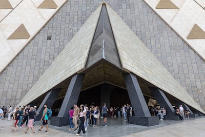 Visitors pass through an entrance to the Grand Egyptian Museum. Bloomberg
