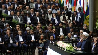 EU foreign policy chief Federica Mogherini, centre, listens as Iran's president Hassan Rouhani delivers a speech after being sworn in before parliament in Tehran, on August 5, 2017. AFP