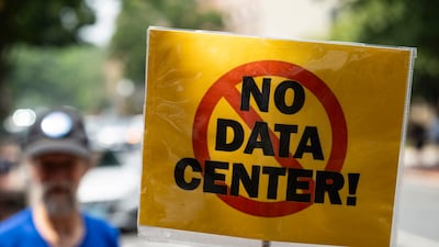 A demonstrator holds a sign during a protest against artificial intelligence in Frederick, Maryland. Bloomberg