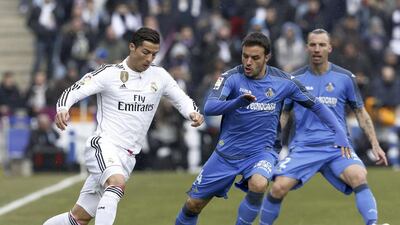epa04566355 Real Madrid's Portuguese forward Cristiano Ronaldo in action against Getafe at the Alonso Perez stadium in Getafe in the outskirts of Madrid, Spain, 18 January 2015. EPA