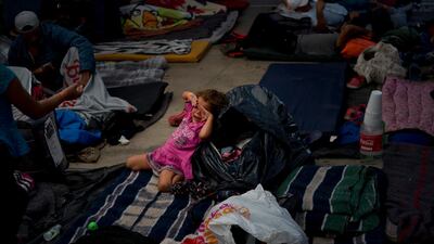 A migrant girl cries at a shelter in Tijuana, Mexico. AP