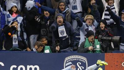 Sporting Kansas Kansas City defender Seth Sinovic (15) celebrates his goal during the second half of an MLS playoff soccer match against the New England Revolution in Kansas City. Orlin Wagner / AP