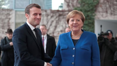 German Chancellor Angela Merkel welcomes French President Emmanuel Macron at the beginning of the Libya summit in Berlin, Germany, January 19, 2020. REUTERS/Axel Schmidt