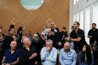 Scuffles broke out in a courtroom before a hearing on the government's dismissal of the head of the Shin Bet domestic intelligence service. Reuters