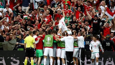 Hungary players celebrate after scoring a goal during the Euro 2016 Group F football match between Iceland and Hungary at the Stade Velodrome in Marseille on June 18, 2016. Odd Andersen / AFP