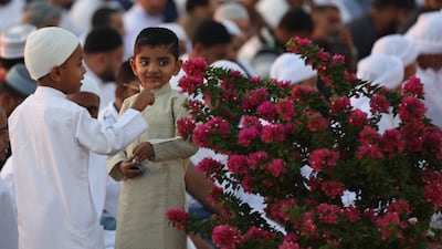 Children at previous Eid Al Fitr prayers in Dubai. Muslims across the Middle East remain determined to celebrate the passing of a spiritually important month. EPA
