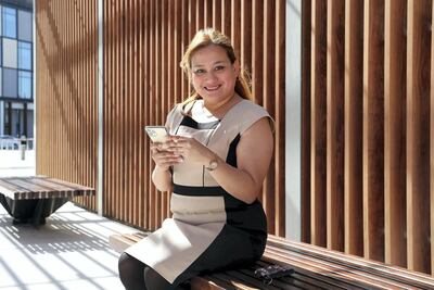 Charmaine Cristobal takes advantage of buy-one-get-one-free vouchers from The Entertainer app. Pawan Singh / The National