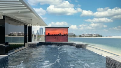 An outdoor cinema will keep swimming guests entertained. Courtesy Luxhabitat Sotheby's International Realty