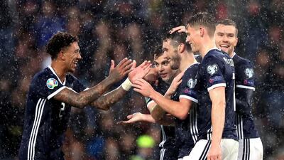 Scotland's John McGinn, center, celebrates scoring during the Euro 2020 qualifying match against San Marino at Hampden Park. Press Association.