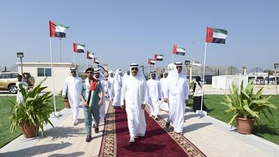 Sheikh Saud bin Rashid Al Mu'alla, Ruler of Umm Al Quwain raised the national flag at Al Khor Park. He was accompanied by Sheikh Rashid bin Saud bin Rashid Al Mu'alla, Crown Prince of Umm Al Quwain. Wam