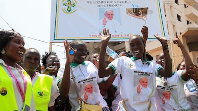 The faithful celebrate Pope Francis's arrival. Reuters