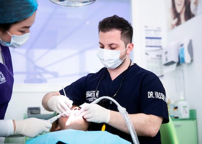 Paediatric dentist, Yasser Agha, in his Abu Dhabi clinic, conducted the study showing issues with labelling of levels of fluoride in baby formula. Reem Mohammed / The National