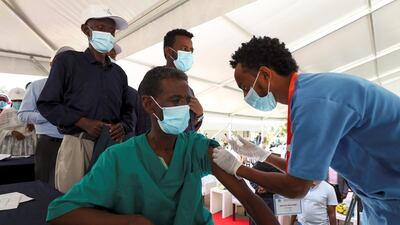 A man is vaccinated with the Oxford-AstraZeneca vaccine under the Covax scheme against the coronavirus at the Eka Kotebe General Hospital in Addis Ababa, Ethiopia. Reuters