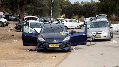 Cars are abandoned near where a festival was held before an attack by Hamas gunmen from Gaza that left at least 260 people dead. Reuters