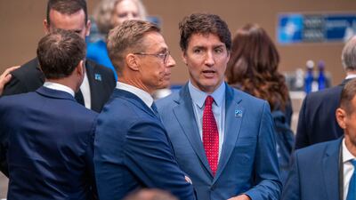 Mr Trudeau and President of Finland Alexander Stubb speak at the summit. EPA