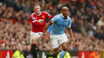 Vincent Kompany, right, has been a wall for Manchester City's defence, particularly against Wayne Rooney and Manchester United. Jason Cairnduff / Reuters