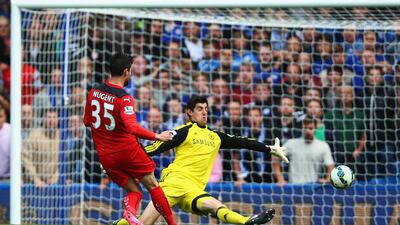 Thibaut Courtois of Chelsea saves from David Nugent of Leicester City during the Barclays Premier League match between Chelsea and Leicester City at Stamford Bridge on August 23, 2014 in London, England. (Photo by Paul Gilham/Getty Images)