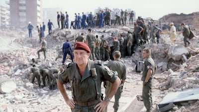 General Francois Cann, commander of the French troops of the multinational forces, on October 23, 1983, as rescuers search for survivors in Beirut through the rubble of a building that was destroyed by a suicide lorry bomber overnight. Fifty-eight French soldiers and five Lebanese were killed in the attack. AFP