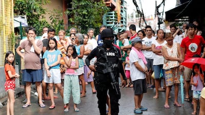 A Filipino SWAT member stands guard during an operation in Manila, 08 August 2018. EPA