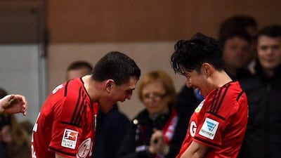Bayer Leverkusen's South Korean striker Son Heung-min celebrates with teammate Kyriakos Papadopoulos after scoring in their 3-0 Bundesliga win over Paderborn on Sunday. Patrik Stollarz / AFP / March 8, 2015