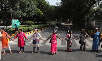 Activists from All India Democratic Women's Association make a human chain during a protest against incidents of sexual assault and harassment in the workplace. Rajat Gupta / EPA