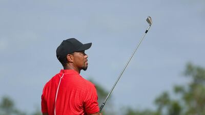 Tiger Woods, in his traditional Sunday red, watches his tee shot on the 12th hole during the final round of the Hero World Challenge at Albany, The Bahamas on December 4, 2016. Christian Petersen / AFP